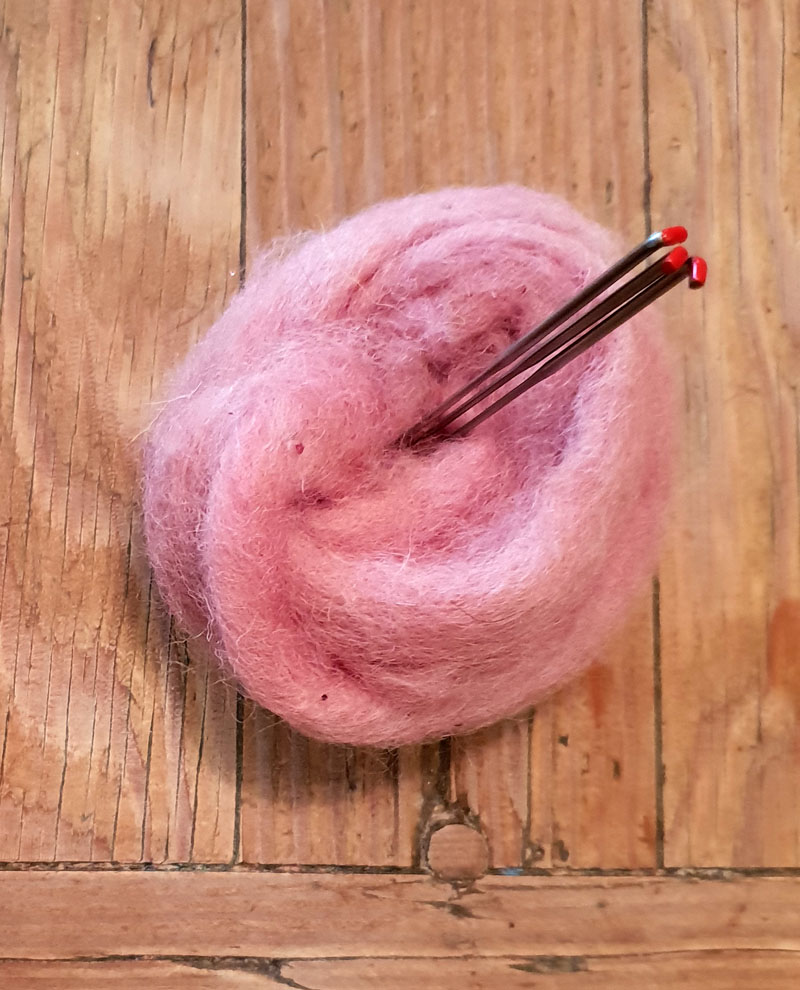 pink wool roving with felting needles